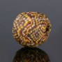 Ancient glass bead with checkerboard pattern